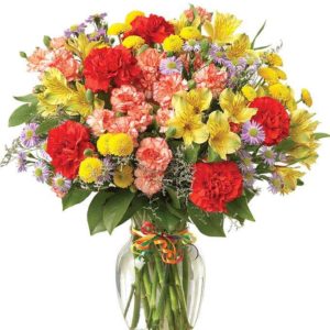 Warm Floret - This arrangement includes Colorful Carnation Variety Alstroemeria & Button Poms