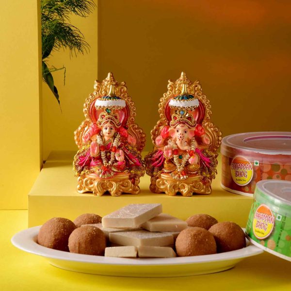 This hamper includes Handmade Lakshmi Ganesha Idol, Kaju Katli & Besan Ladoo