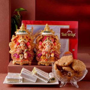 This hamper includes Handmade Lakshmi Ganesha Idol, Pista Roll & Mini Mathri