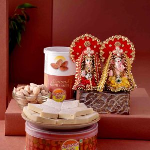 This hamper includes Handmade Lakshmi Ganesha Idol, Kaju Katli & Almond can
