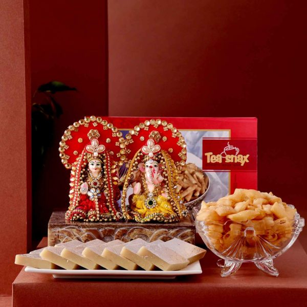 This hamper includes Handmade Lakshmi Ganesha Idol, Kaju Katli & Namakpara