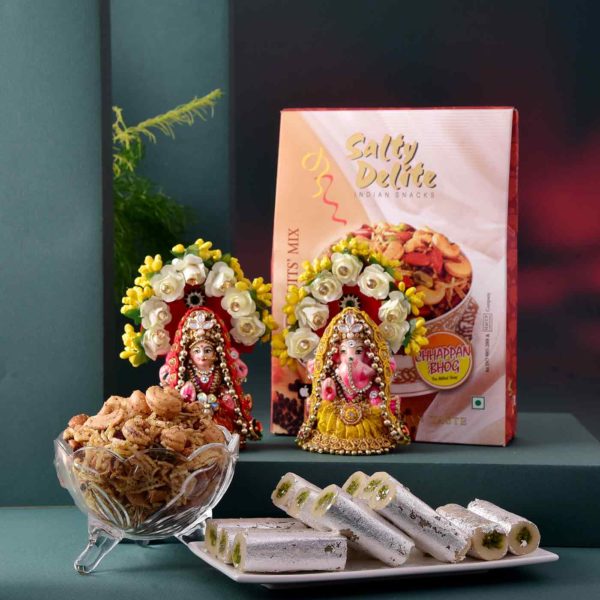 This hamper includes Handmade Lakshmi Ganesha Idol, Pista Roll & Dryfruit Mix