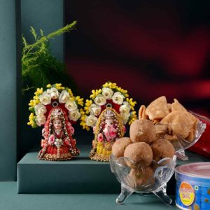 This hamper includes Handmade Lakshmi Ganesha Idol, Panjiri Ladoo, & Mini Suhal