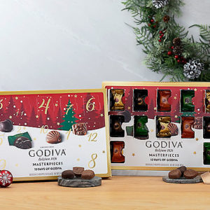 Godiva Chocolate box with 12 creamy milk and dark chocolates in it