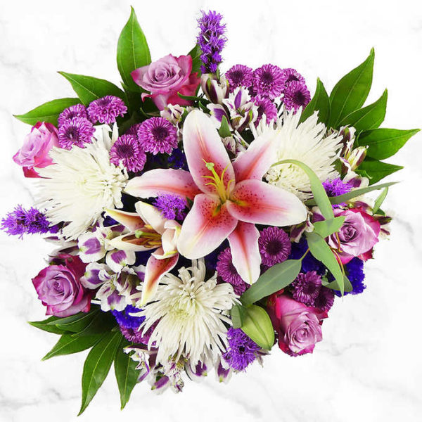 Lily Love Floral Bouquet beautifully arranged with fresh roses, stargazer lilies, alstroemeria, and much more.