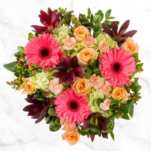 Pink Daisy Floral Bouquet with farm fresh peach roses, pink gerbera daisies, and hydrangeas.