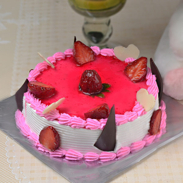 Exotic Strawberry Birthday Cake with some pieces of strawberries on the top