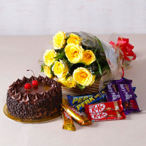 Birthday Chocolaty Treat hamper comprises Bunch of Yellow Roses along with Assorted Cadbury Chocolate Bars and a Chocolate Cake.