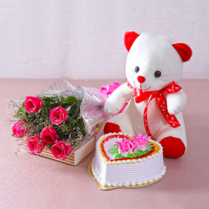 Bouquet of Pink Roses along with Heart Shape Vanilla Cake and Teddy Bear